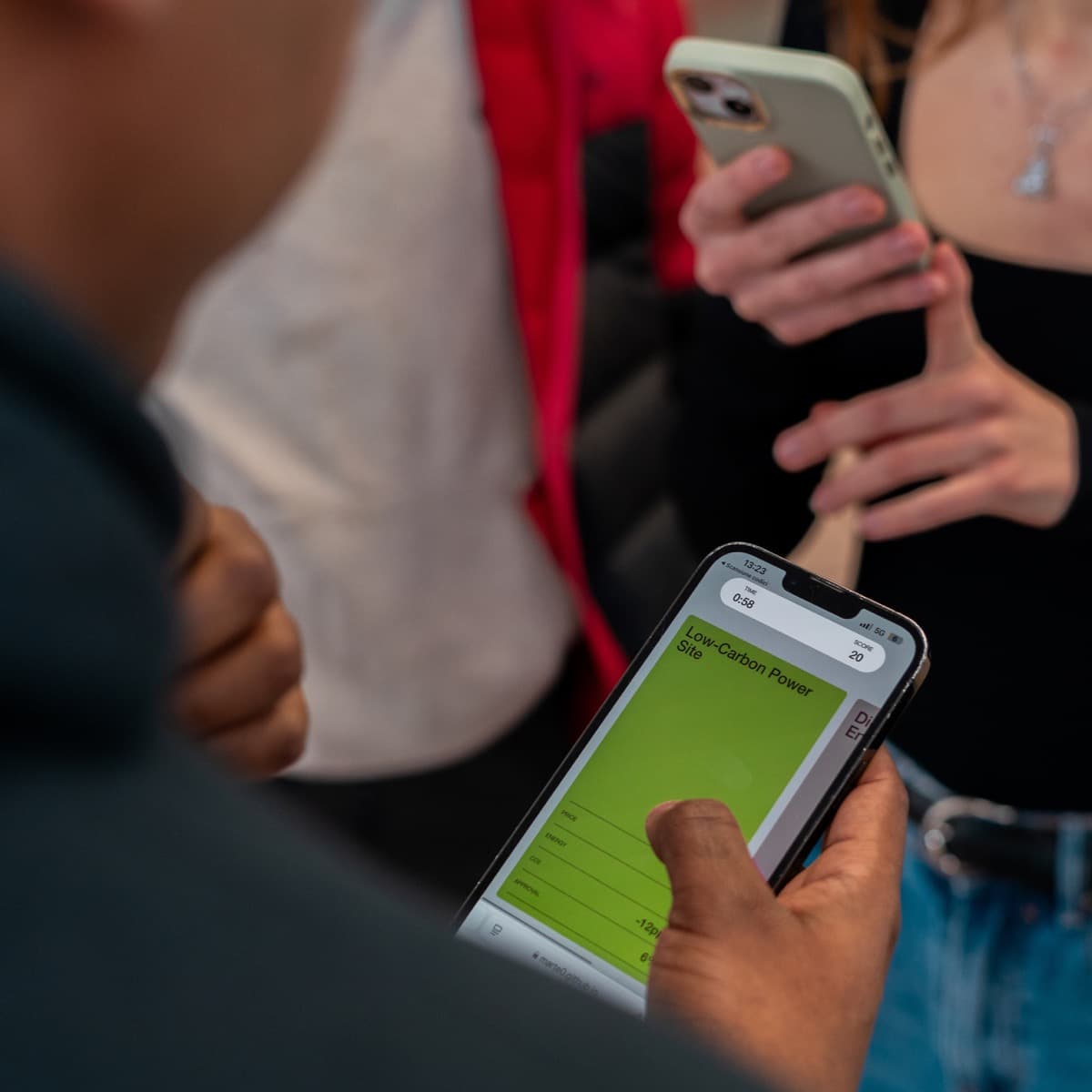 Low-carbon power site card on a phone during gameplay