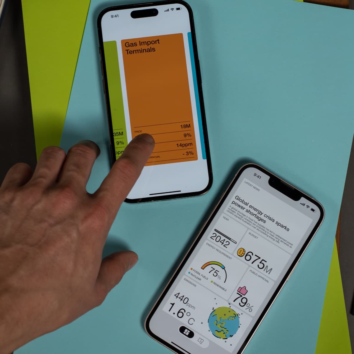 Two phones showing gas import terminals and the energy crisis dashboard