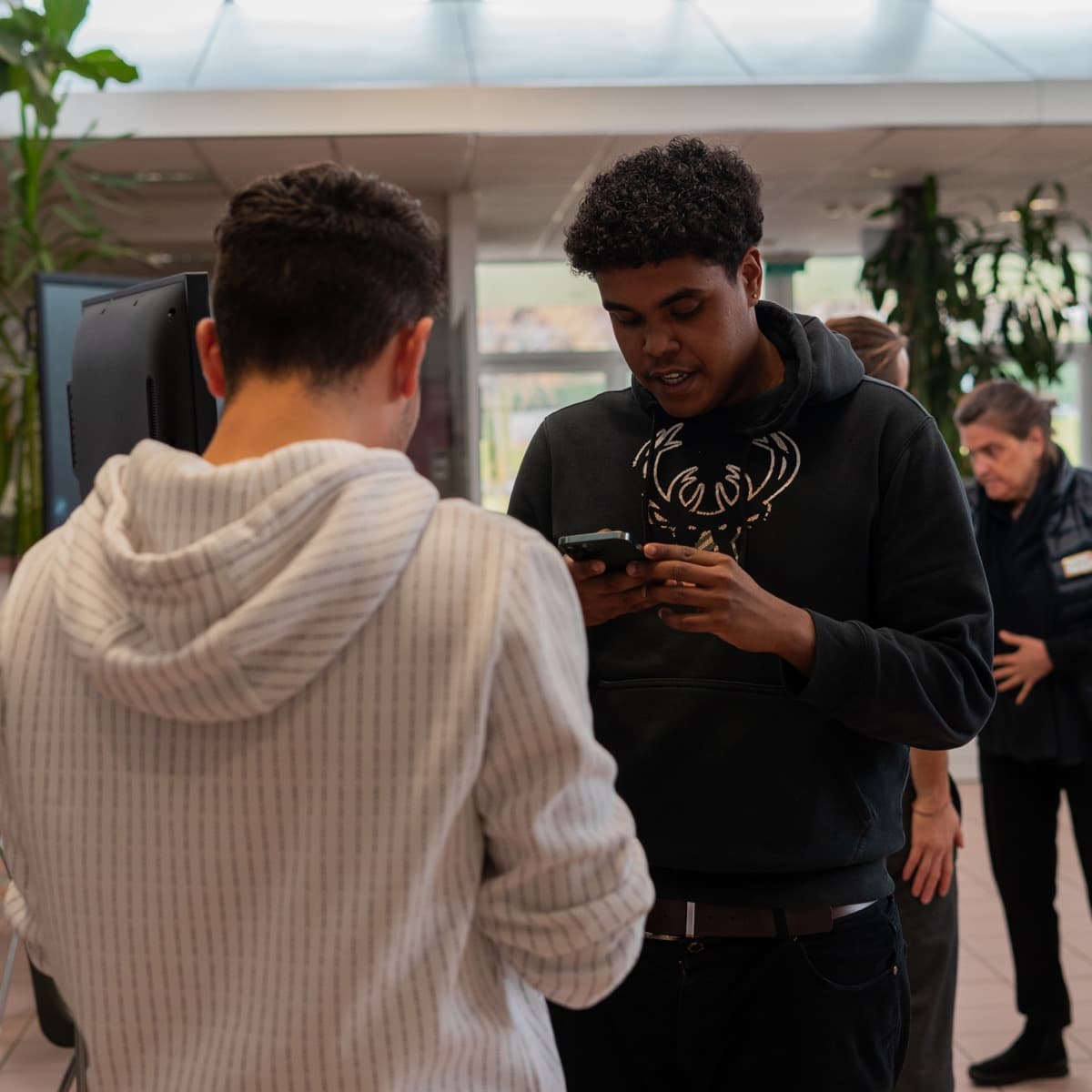 Two students playing the cooperative energy game together